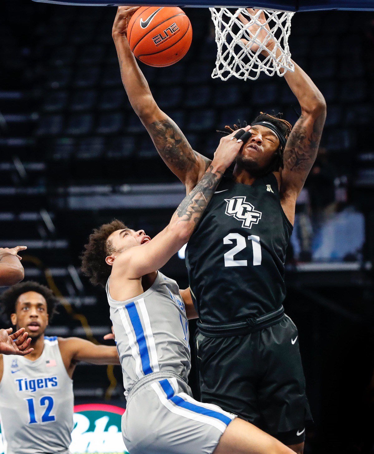 <strong>Tigers guard Lester Quinones (left) battles UCF forward C.J. Walker (right) for a rebound on Wednesday, Feb. 3, 2021.</strong> (Mark Weber/The Daily Memphian)