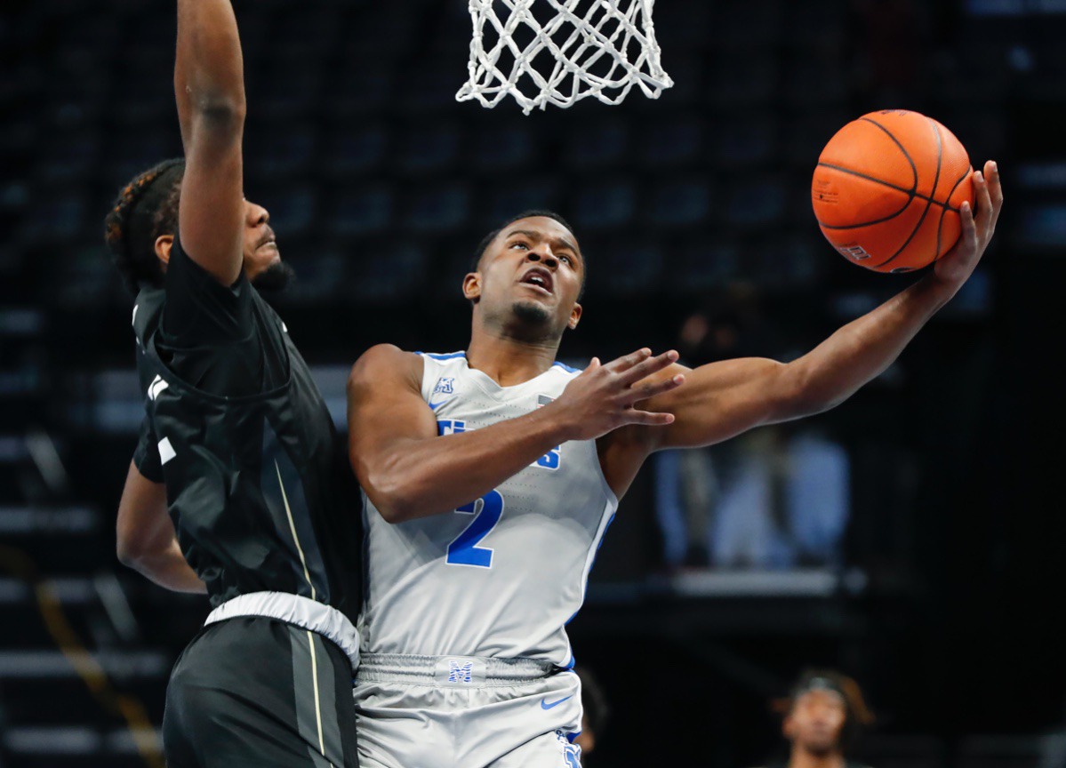 <strong>Tigers guard Alex Lomax (right) drives to the basket against UCF&rsquo;s Darius Perry (left) on Wednesday, Feb. 3, 2021.</strong> (Mark Weber/The Daily Memphian)