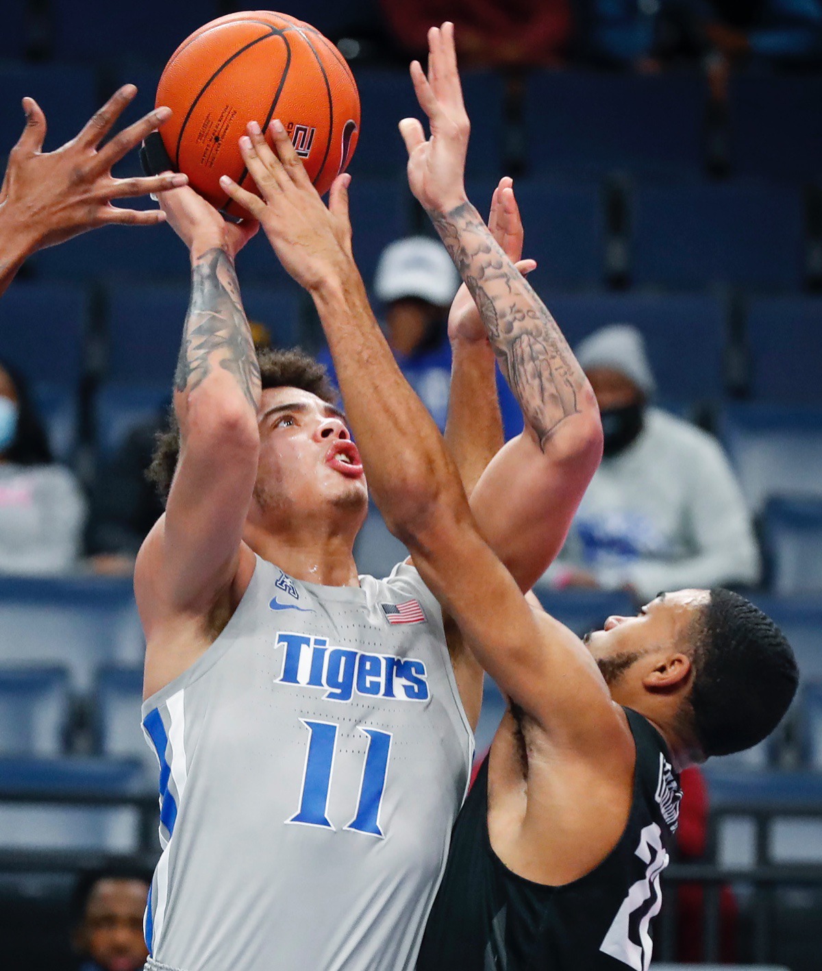 <strong>Tigers guard Lester Quinones (left) drives to the basket against UCF&rsquo;s C.J. Walker (right) on Wednesday, Feb. 3, 2021.</strong> (Mark Weber/The Daily Memphian)
