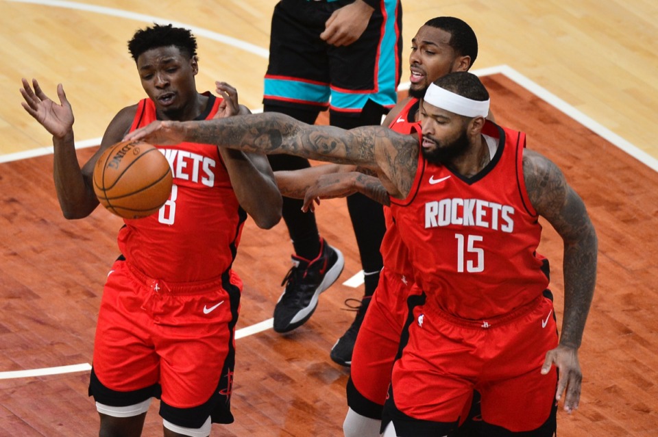 <strong>Houston Rockets forward Jae'Sean Tate (8), center DeMarcus Cousins (15) and guard Sterling Brown (0) had a lot to celebrate on a night where the ball bounced their way.</strong> (Brandon Dill/AP)