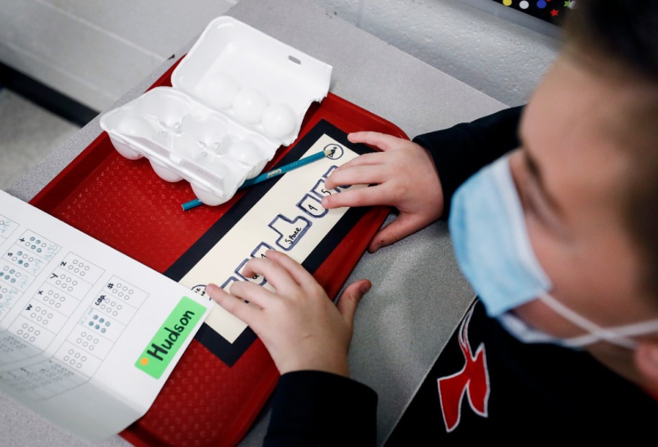 <strong>Fifth-grader Hudson Talbot uses a paper keyboard while learning Braille on Thursday, Feb. 4, at Tara Oaks Elementary.</strong> (Mark Weber/Daily Memphian)