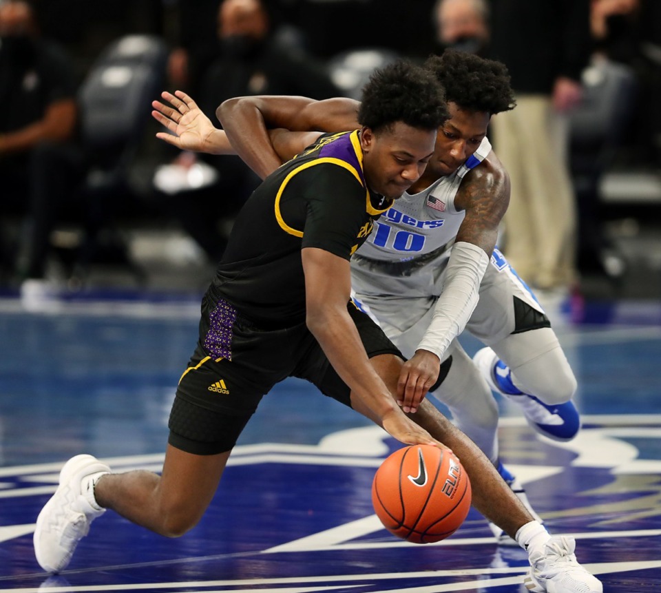 <strong>Memphis Tigers guard Damion Baugh (10) goes for a steal during a Feb. 6, 2021 game against ECU at the FedExForum.</strong> (Patrick Lantrip/Daily Memphian)