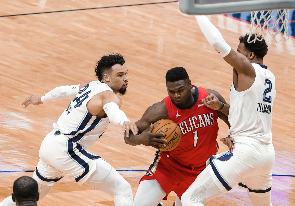 <strong>New Orleans Pelicans forward Zion Williamson (1) drives between Memphis Grizzlies guard Dillon Brooks (24) and forward Xavier Tillman (2) during the first quarter of an NBA basketball game in New Orleans, Saturday, Feb. 6, 2021.</strong> (Derick Hingle/AP)
