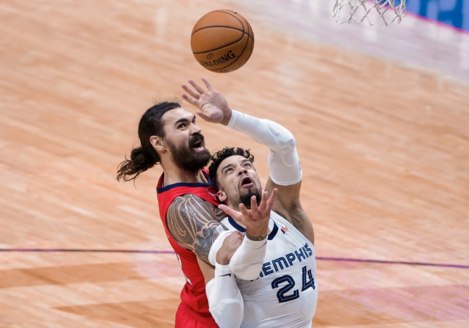 <strong>New Orleans Pelicans center Steven Adams (12) and Memphis Grizzlies guard Dillon Brooks (24) go for a rebound during the third quarter of an NBA basketball game in New Orleans, Saturday, Feb. 6, 2021. Adams was called for a foul.</strong> (Derick Hingle/AP)