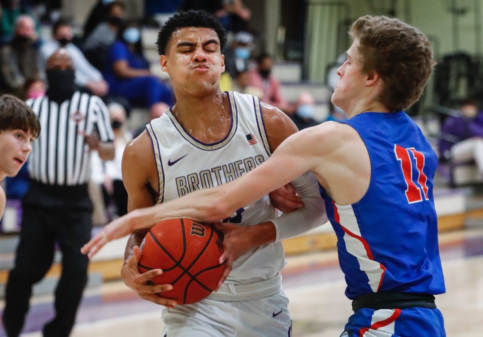 <strong>Christian Brothers guard Reese McMullen (left) is fouled by MUS defender Henry Nickey (right) on Tuesday, Feb. 9, 2021.</strong> (Mark Weber/The Daily Memphian)