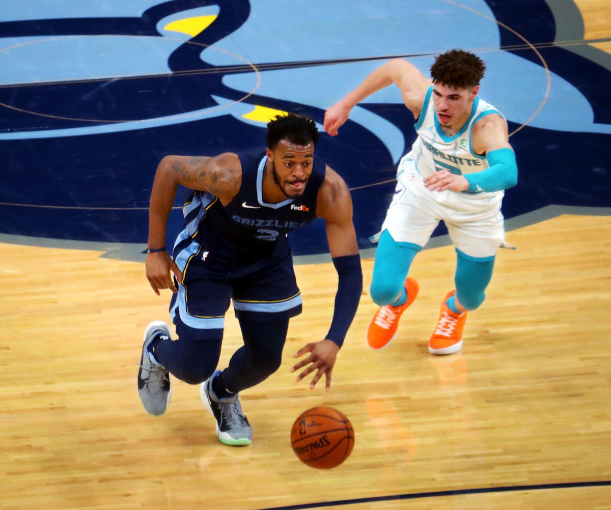 <strong>Memphis Grizzles forward Xavier Tillman Sr. (2) brings the ball upcourt while chased by Charlotte Hornets guard LaMelo Ball (2) on Feb. 10 at FedExForum.</strong> (Patrick Lantrip/Daily Memphian)