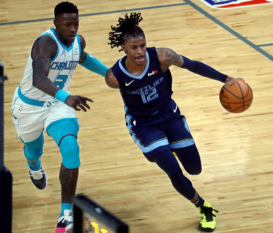 <strong>Memphis Grizzles guard Ja Morant (2) dribbles past Charlotte Hornets guard Terry Rozier (3) on Feb. 10 at FedExForum.</strong> (Patrick Lantrip/Daily Memphian)