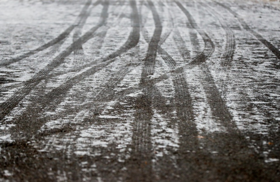 <strong>Tire tracks in the ice cover the ground on Veterans Plaza Drive in Overton Park on Thursday, Feb. 11.</strong> (Mark Weber/Daily Memphian)