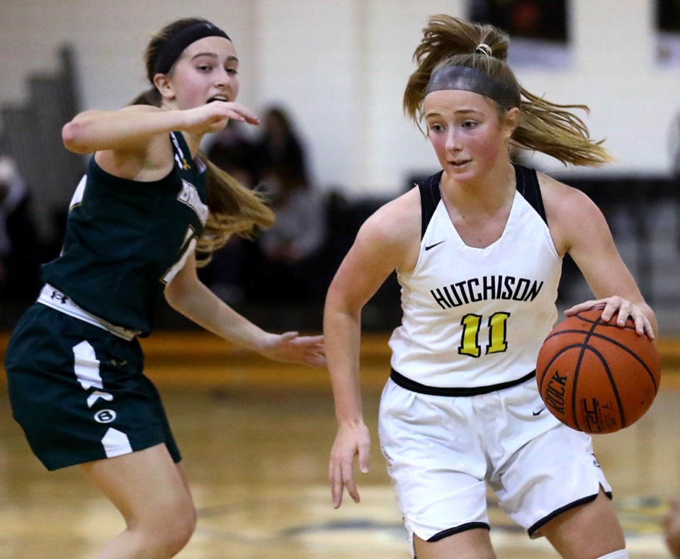 <strong>Hutchison High School's Berklee Scifres (11) brings the ball upcourt against Briarcrest Christian School's Julia Bonasso (10) during the Feb. 12, 2021, game.</strong> (Patrick Lantrip/Daily Memphian)