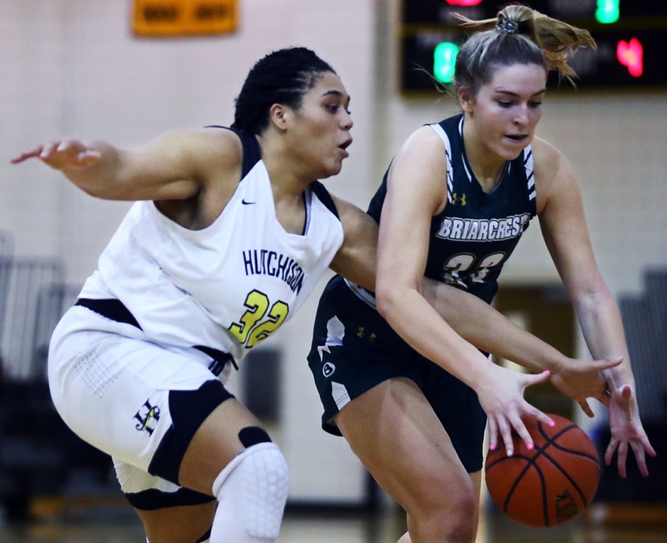 <strong>Hutchison High School's Kaia Barnett (32) tries to steal the ball from Briarcrest Christian School's Kayli Clarkson (23) during the Feb. 12, 2021, game.</strong> (Patrick Lantrip/Daily Memphian)