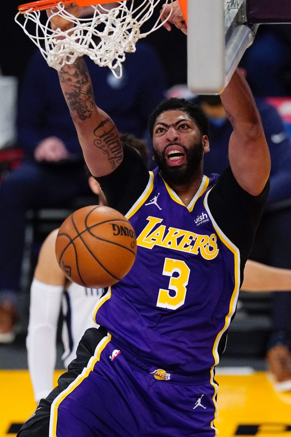 <strong>Lakers forward Anthony Davis dunks against the Grizzlies in Los Angeles on Feb. 12.</strong> (Mark J. Terrill/AP)