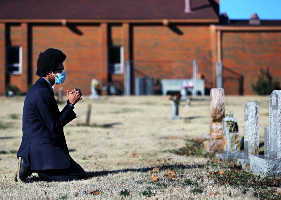<strong>Justin Pearson, co-founder of Memphis Community Against the Pipeline, which is leading the fight against the Byhalia Connection pipeline, prays at the grave of his great-grandmother at Mount&nbsp; Pisgah Baptist Church. Mount Pisgah is across the street from where the pipeline will run.</strong> <strong>&ldquo;This is all of Memphis&rsquo; fight, not just southwest Memphis or South Memphis,&rdquo; Pearson said Monday, Feb. 15.</strong> (Patrick Lantrip/Daily Memphian)