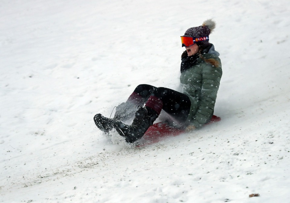 <strong>Addie Ray rides a sled down the Mississippi River Bluffs in Downtown Memphis on Wednesday, Feb. 17.</strong> (Patrick Lantrip/Daily Memphian)