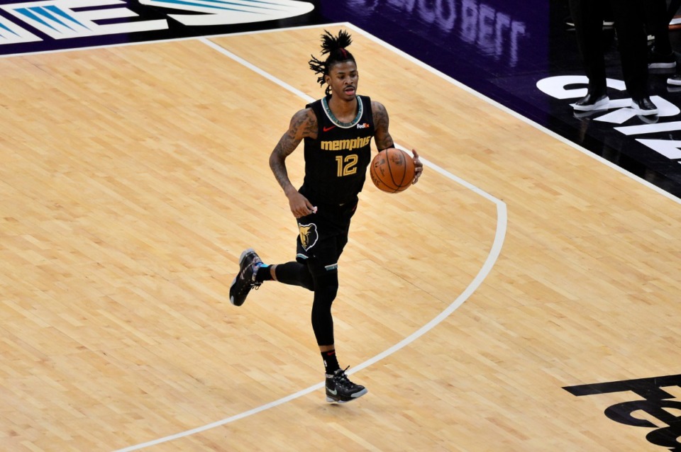 <strong>Grizzlies guard Ja Morant (12), seen here playing against the Pelicans Feb. 16, made strong runs in the last two quarters against the Thunder Wednesday night. Morant finished with 15 points, 12 assists and 11 rebounds for his third career triple-double.</strong> (Brandon Dill/AP file)