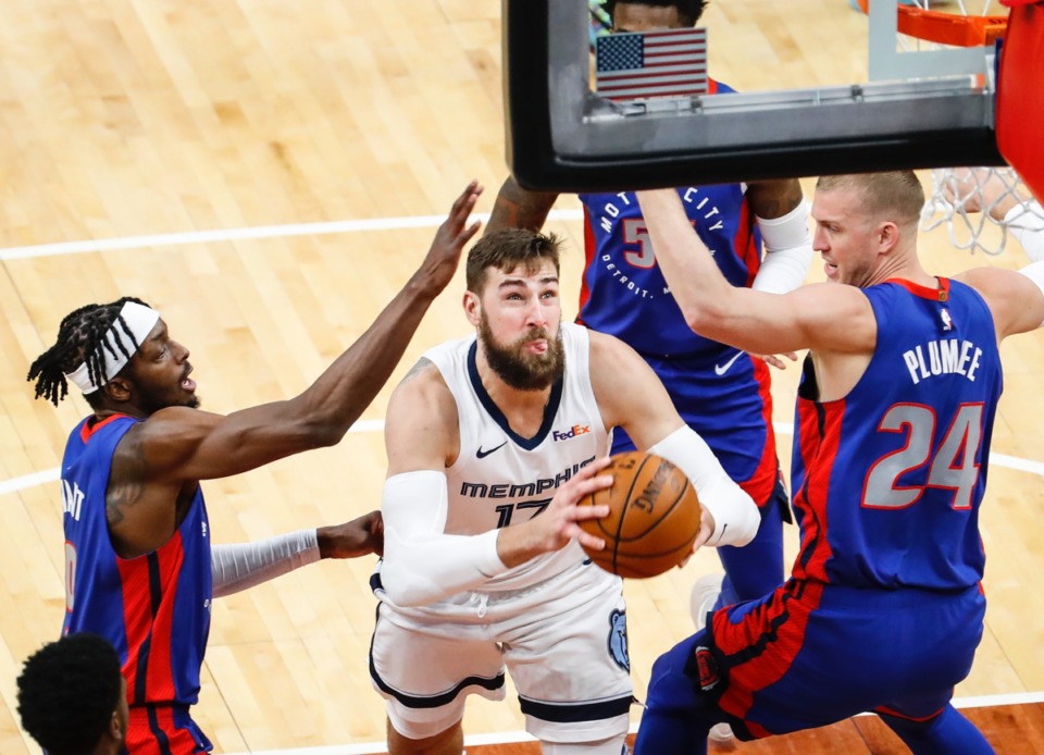 <strong>Grizzlies center Jonas Valanciunas (middle) drives to the basket against Detroit&rsquo;s Isaiah Stewart (left) and Mason Plumlee (right) on Feb. 19, 2021.</strong> (Mark Weber/The Daily Memphian)