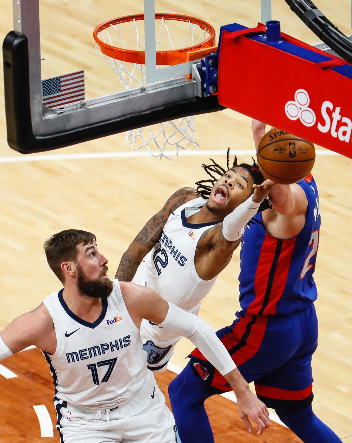 <strong>Grizzlies guard Ja Morant (middle) drives for a layup against the Detroit Pistons on Friday, Feb. 19, 2021.</strong> (Mark Weber/The Daily Memphian)