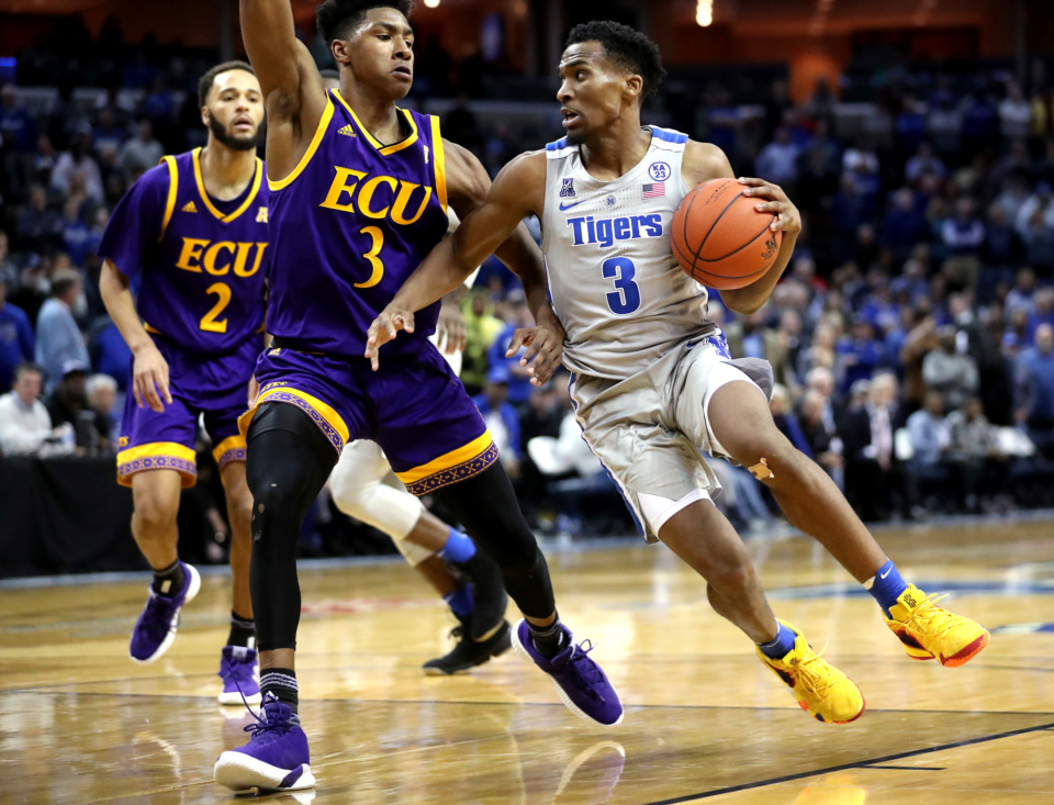 <strong>Memphis guard Jeremiah Martin (3) drives to the basket against East Carolina University guard Seth Leday (3).</strong> (Houston Cofield/Daily Memphian)