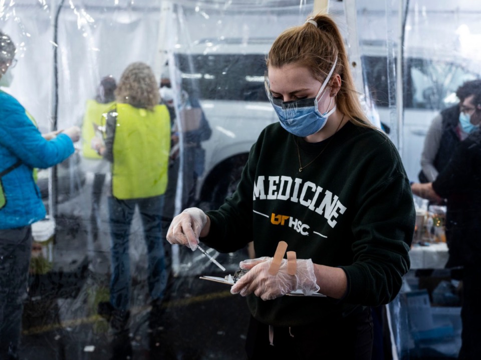 <strong>Whitney Gulledge, a UTHSC medical student, prepares to administer a vaccination on Sunday, Feb. 21, 2021 at Southwest Tennessee Community College - Whitehaven. Center.</strong> (Brad Vest/Special to The Daily Memphian)