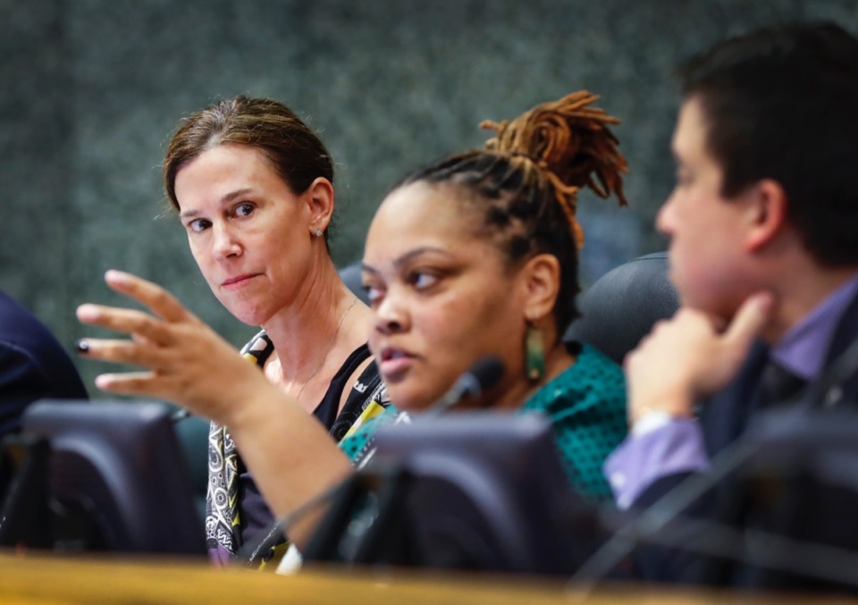 <strong>Shelby County Commissioner Brandon Morrison (left) suggested reducing the projected goals for county purchasing going to locally-owned small businesses, but her effort failed. Also at the meeting, commissioner Tami Sawyer (middle) withdrew her resolution to change grooming standards for county public safety employees.</strong> (Mark Weber/Daily Memphian file)