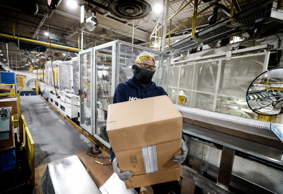 <strong>Kruger Products employee Brandon Bishop prepares facial tissue for packing on Tuesday, Feb. 23, 2021.</strong> (Mark Weber/The Daily Memphian)