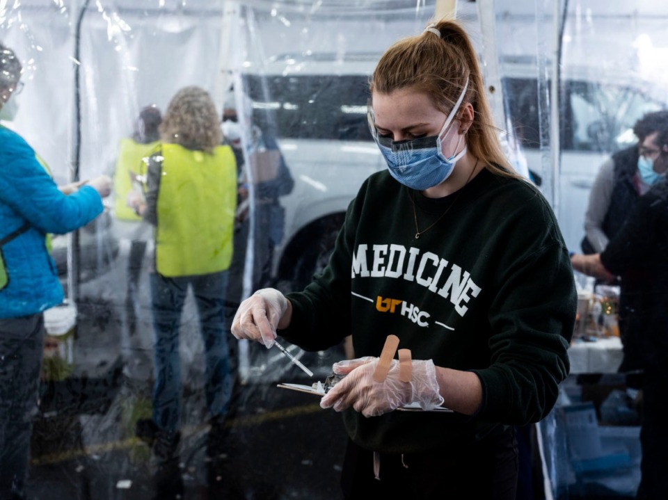 <strong>Whitney Gulledge, a first year UTHSC medical student, prepares to administer a vaccination on Sunday, Febr. 21, 2021, at Southwest Tennessee Community College&nbsp;&mdash; Whitehaven Center.</strong> (Brad Vest/Special to The Daily Memphian)
