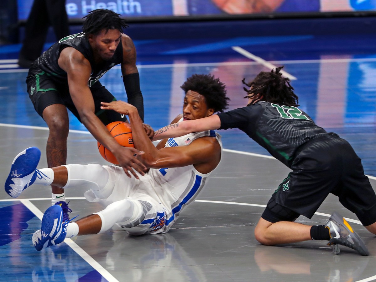 <strong>University of Memphis forward Deandre Williams (12) fights for a loose ball on Feb. 24, 2021, during the game against Tulane.</strong> (Patrick Lantrip/Daily Memphian)