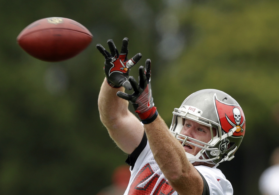<span><strong>Tampa Bay Buccaneers tight end Alan Cross (45) goes up for a pass during NFL football minicamp in June 2017. Cross will join Mike Norvell's staff as a graduate assistant on this year's Tiger football staff.&nbsp;</strong>&nbsp;(AP Photo/Chris O'Meara)</span>
