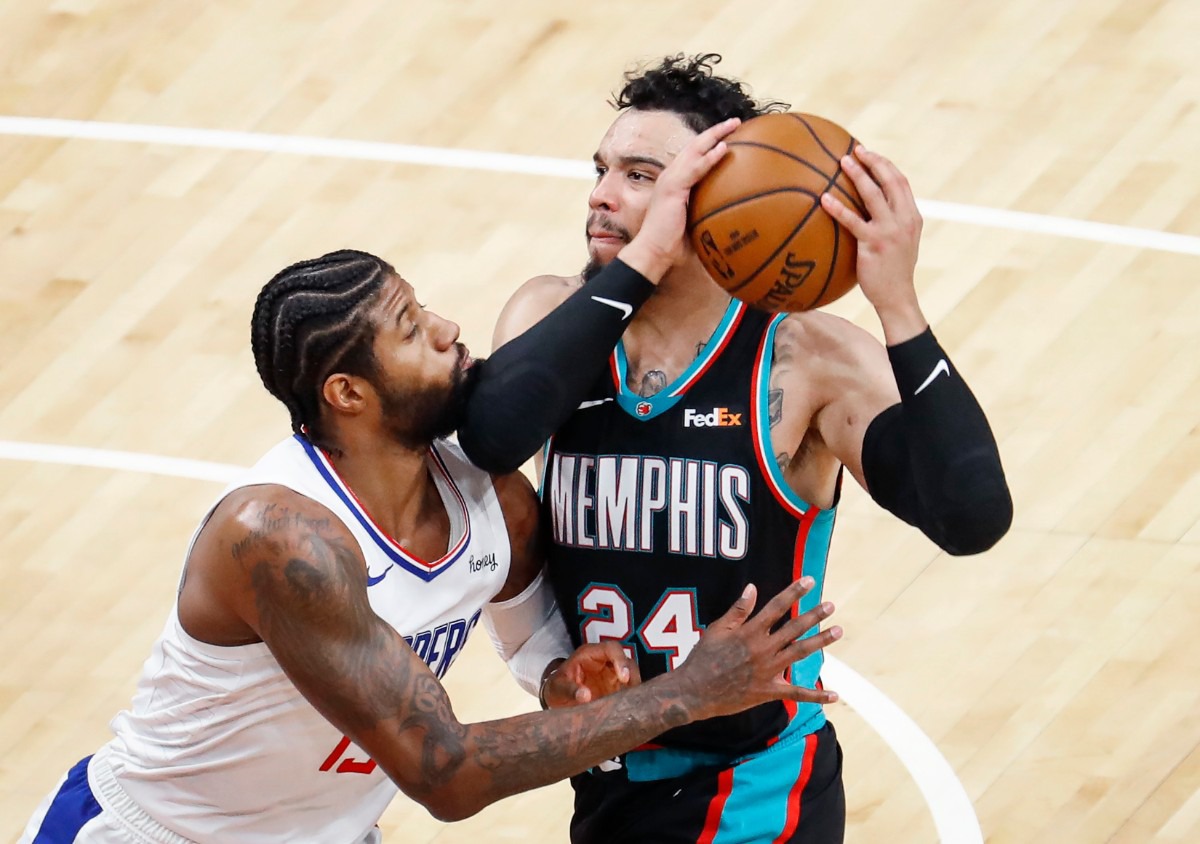 <strong>Grizzlies guard Dillion Brooks (right) drives the lane against Los Angeles&rsquo; Paul George (left) on Thursday, Feb. 25, 2021.</strong> (Mark Weber/The Daily Memphian)