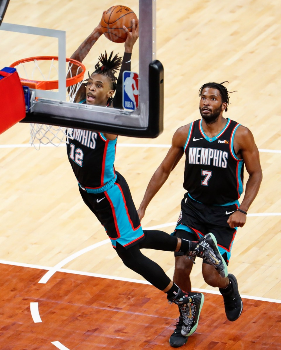 <strong>Grizzlies guard Ja Morant dunks as Justise Winslow (right) watches in the game against the Los Angeles Clippers on Thursday, Feb. 25, 2021.</strong> (Mark Weber/The Daily Memphian)