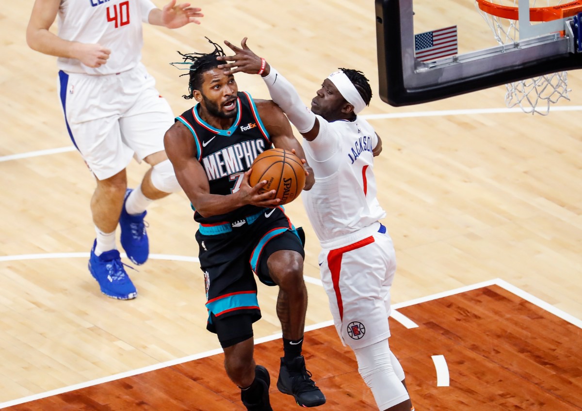 <strong>Grizzlies guard Justise Winslow (left) drives for a layup against Los Angeles&rsquo; Reggie Jackson (right) on Thursday, Feb. 25, 2021.</strong> (Mark Weber/The Daily Memphian)