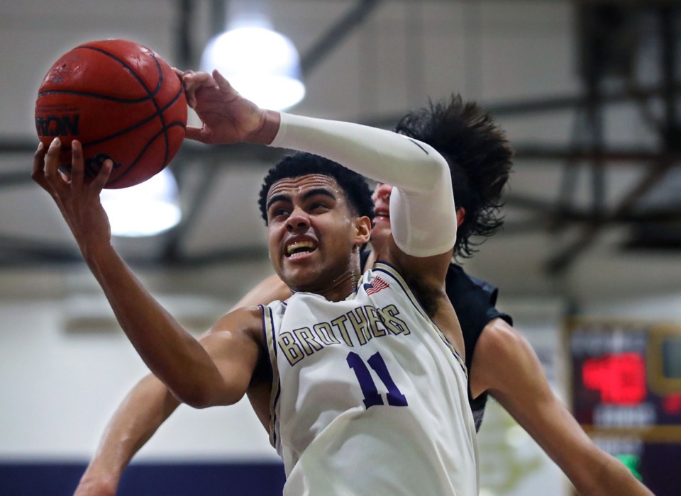 <strong>CBHS guard Reece McMullen (11) grabs a rebound during a Feb. 27, 2021 game against Lipscomb Academy in Memphis.</strong> (Patrick Lantrip/Daily Memphian)