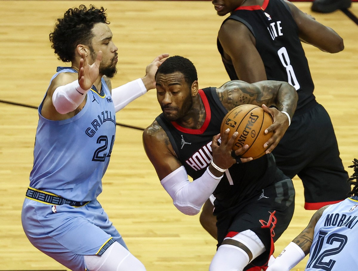 <strong>Houston Rockets guard John Wall (1) drives with the ball as Memphis Grizzlies guard Dillon Brooks (24) defends during the second quarter of an NBA basketball game Sunday, Feb. 28, 2021, in Houston.</strong> (Troy Taormina/AP)