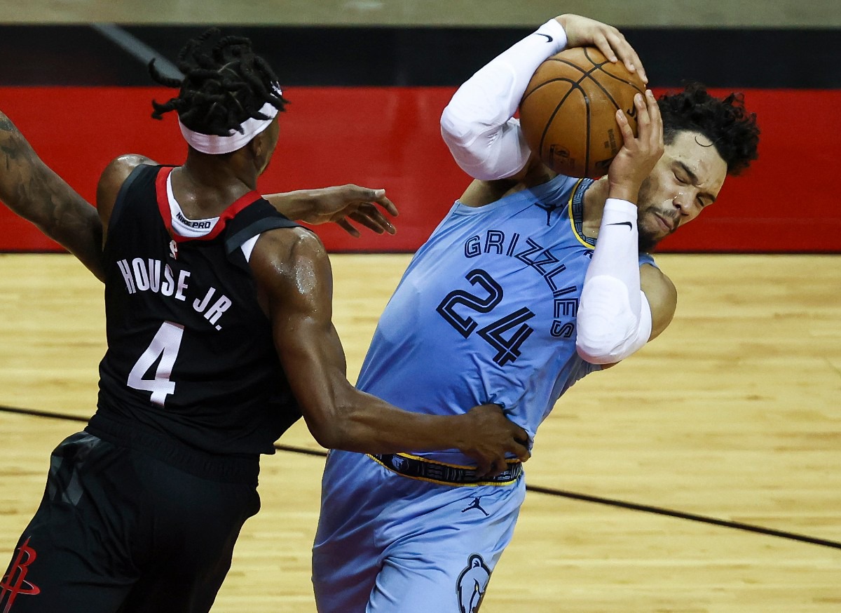 <strong>Memphis Grizzlies guard Dillon Brooks (24) attempts to keep control of the ball as Houston Rockets forward Danuel House Jr. (4) defends during the third quarter of an NBA basketball game Sunday, Feb. 28, 2021, in Houston.</strong> (Troy Taormina/AP)