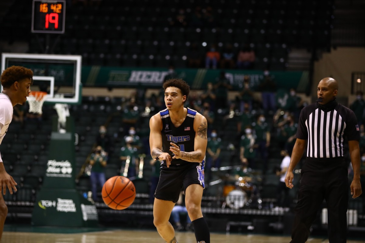 <strong>Memphis Tiger Lester Quinones bounce-passes while assessing the situation in the game against USF on March 2, 2021.</strong> (Courtesy University of Memphis)