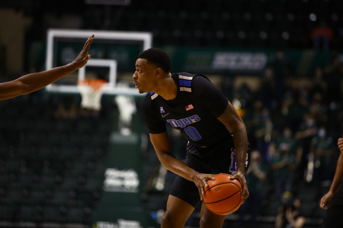 <strong>Memphis Tiger D.J. Jeffries looks for an open man in the game against USF on March 2, 2021.</strong> (Courtesy University of Memphis)