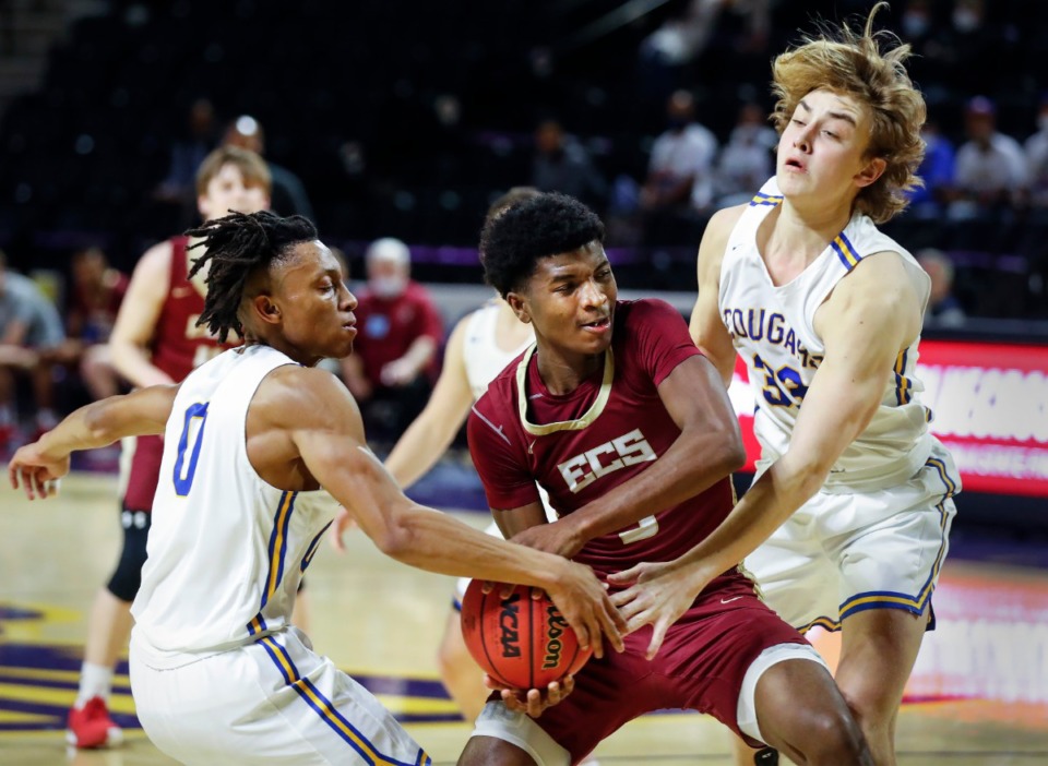 <strong>ECS guard Kameron Jones (right) drives to the basket against Goodpasture Christian defenders Patrick Smith (left) and Jack Carter (right) during the Division II Class A semifinals game on Thursday, March 4, 2021, in Cookeville.</strong> (Mark Weber/The Daily Memphian)