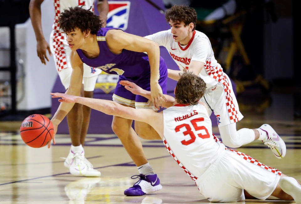 <strong>Tipton-Rosemark defenders Eli Ramsey (bottom) and Thano Sinis (right) battle Christ Presbyterian forward Jordan Dewalt (left) for a loose ball during the Division II Class A semifinals game on Thursday, March 4, 2021, in Cookeville.</strong> (Mark Weber/The Daily Memphian)