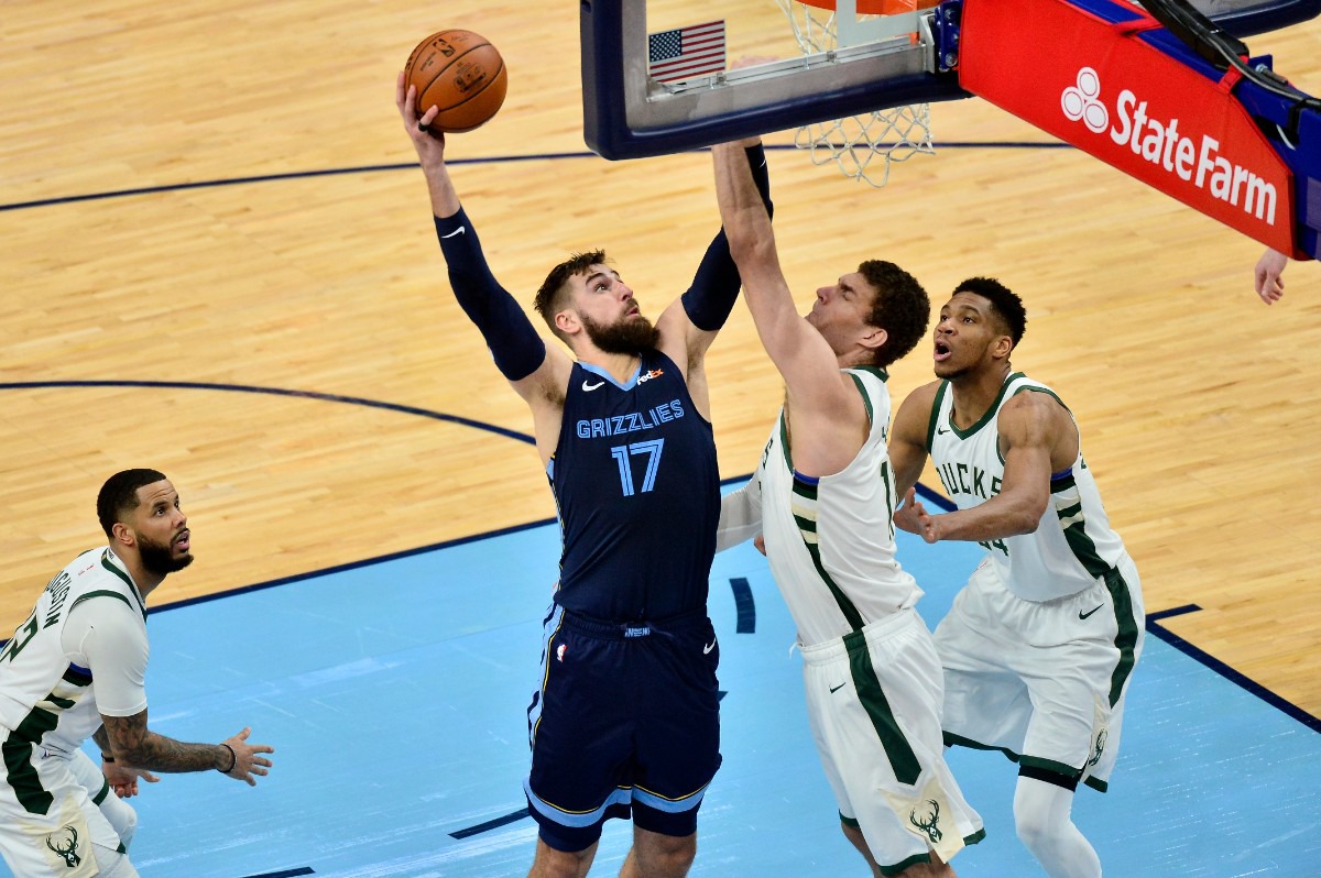 <strong>Grizzlies center Jonas Valanciunas (17) shoots against Milwaukee Bucks center Brook Lopez on March 4 at FedExForum.</strong> (Brandon Dill/AP)