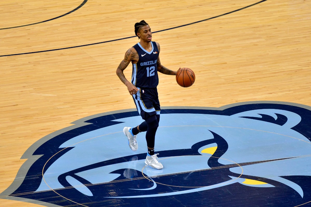 <strong>Grizzlies guard Ja Morant (12) brings the ball upcourt against the Milwaukee Bucks</strong>&nbsp;<strong>on March 4 at FedExForum.</strong> (Brandon Dill/AP)