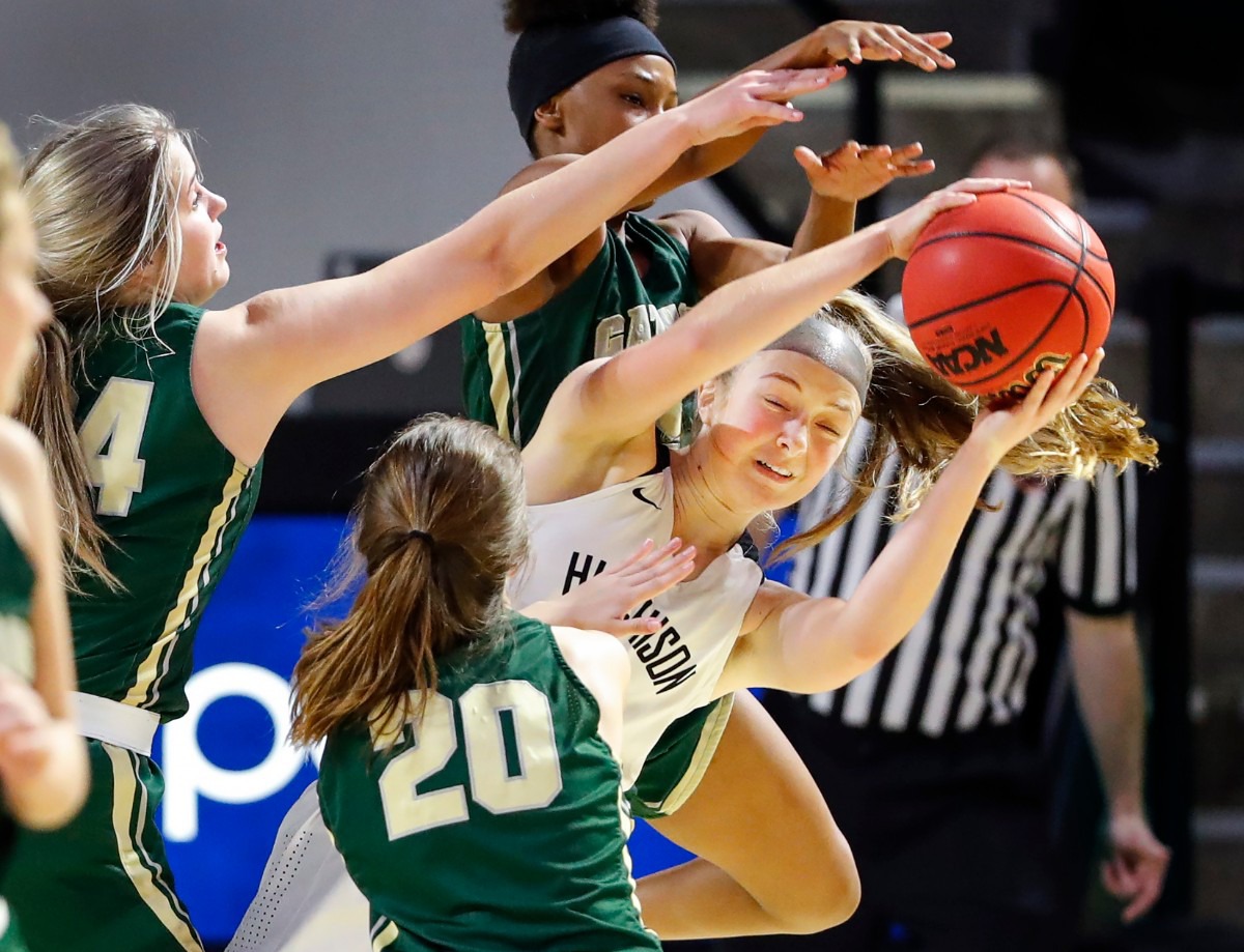 <strong>Hutchison guard Berklee Scifres (right) grabs a rebound away from Knoxville Catholic players during action of the Division II Class AA finals game on Saturday, March 6, 2021 in Cookeville.</strong> (Mark Weber/The Daily Memphian)