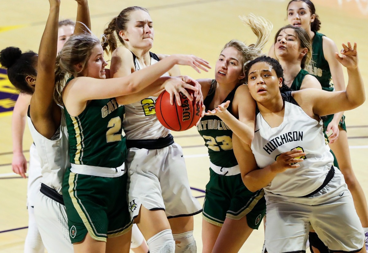 <strong>Hutchison forward Kaia Barnett (right) looks on as teammates Maxine Engel (second left) battles for a rebound against Knoxville Catholic during action of the Division II Class AA finals game on Saturday, March 6, 2021 in Cookeville.</strong> (Mark Weber/The Daily Memphian)