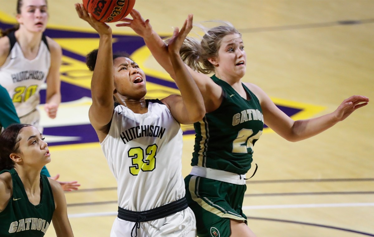 <strong>Hutchison forward Carmyn Harrison (left) drives for a layup against Knoxville Catholic defender Sydney Mains (right) during action of the Division II Class AA finals game on Saturday, March 6, 2021 in Cookeville.</strong> (Mark Weber/The Daily Memphian)