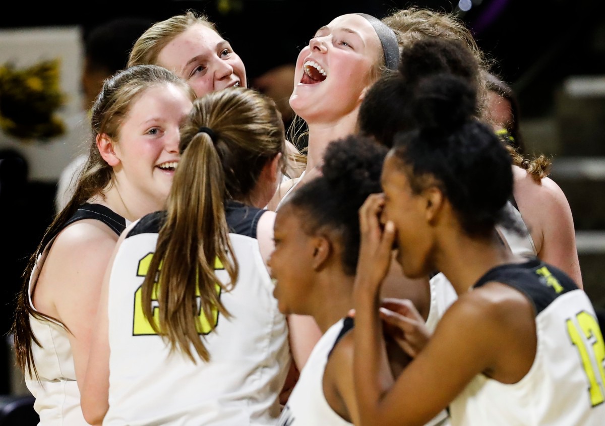 <strong>Hutchison guard Berklee Scifres (middle) celebrates with her teammates after defeating Knoxville Catholic 41-34 during action of the Division II Class AA finals game on Saturday, March 6, 2021 in Cookeville.</strong> (Mark Weber/The Daily Memphian)