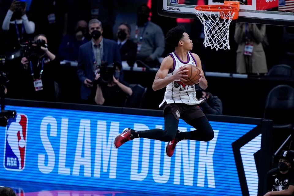 <strong>Portland Trail Blazers' Anfernee Simons competes in the Slam Dunk contest during basketball's NBA All-Star Game in Atlanta on March 7.</strong> (AP Photo/Brynn Anderson)
