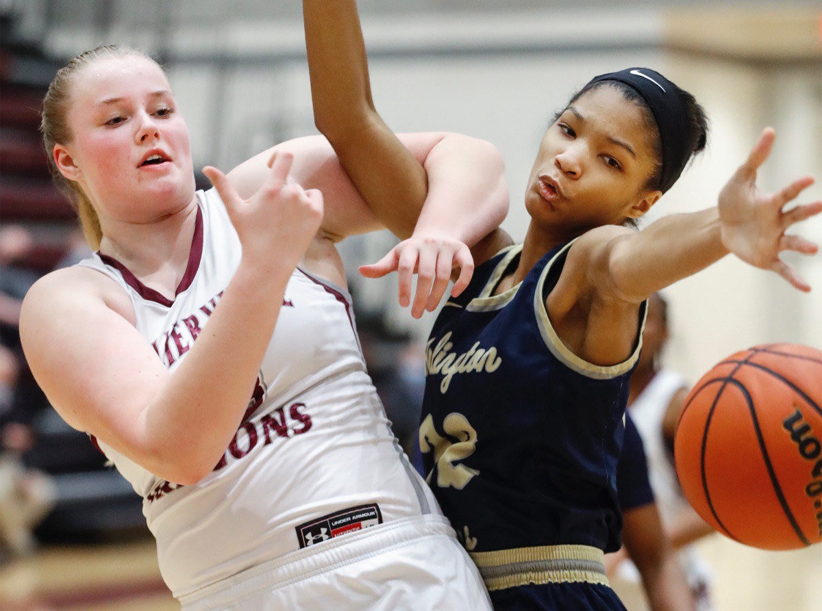 <strong>Collierville forward Madison Lovelace (left) battles Arlington defender Taylor Dupree (right) for a loose ball on Monday, March 8, 2021.</strong> (Mark Weber/The Daily Memphian)