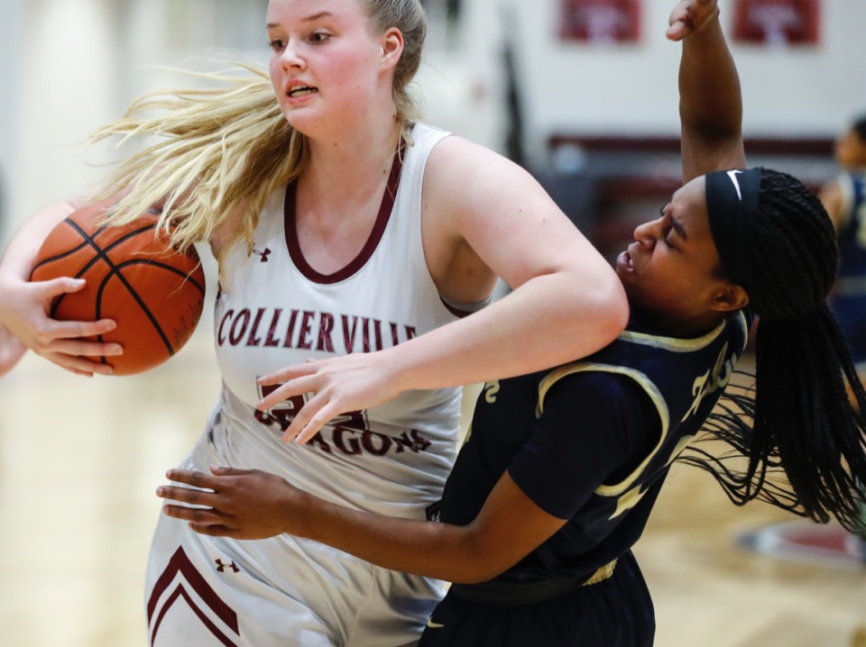 <strong>Collierville forward Madison Lovelace (left) battles Arlington&rsquo;s Carmen Taylor (right) for a loose ball on Monday, March 8, 2021.</strong> (Mark Weber/The Daily Memphian)
