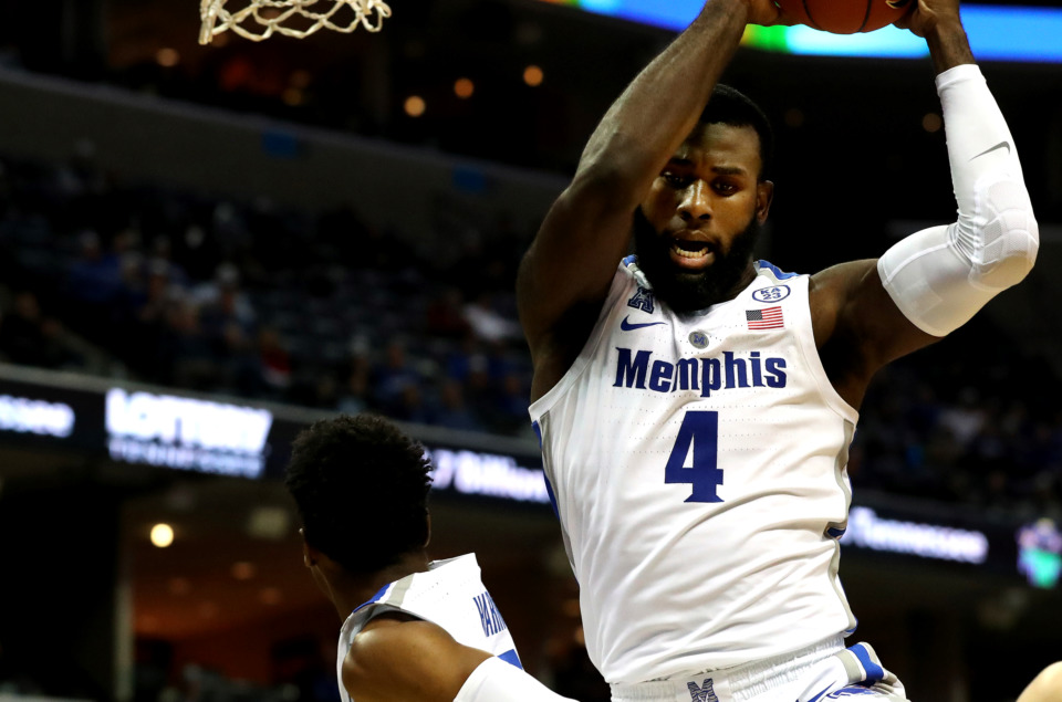<strong>Memphis senior forward Raynere Thornton (4) reaches for a rebound during a game against South Dakota State on Dec. 4, 2018.&nbsp;The Tigers, who are 11-6 and 3-1 in the AAC, will need to improve their rebounding as they face tougher conference matchups ahead.</strong>&nbsp;(Houston Cofield/Daily Memphian file)