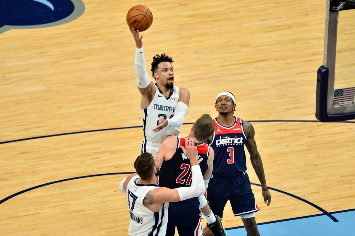 <strong>Grizzlies guard Dillon Brooks (24) shoots against Washington Wizards center Moritz Wagner (21) and guard Bradley Beal (3)&nbsp;on March 10 at FedExForum.</strong> (Brandon Dill/AP)