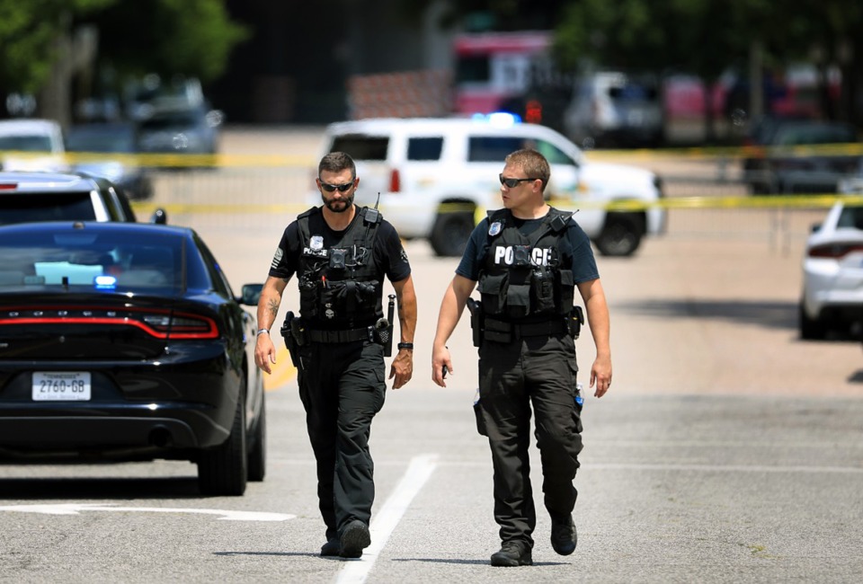 <strong>Two Memphis Police officers survey a chaotic crime scene in Downtown Memphis during 2019.</strong> (Patrick Lantrip/Daily Memphian file photo)