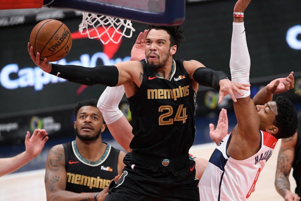 <strong>Memphis Grizzlies guard Dillon Brooks (24) goes to the basket past Washington Wizards forward Rui Hachimura (8) during a March 2, 2021, NBA game.</strong> (AP Photo/Nick Wass)
